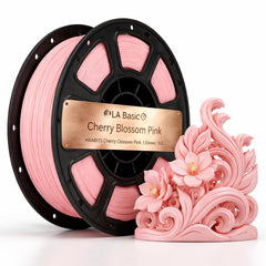Spool of pink 3D printing filament with a decorative pink flower sculpture on a white background