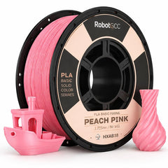 Spool of Peach Pink 3D printing filament with printed objects on a white background
