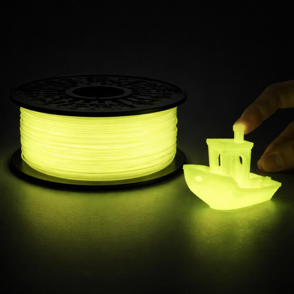 Spool of glowing green filament and a small 3D printed object on a dark background