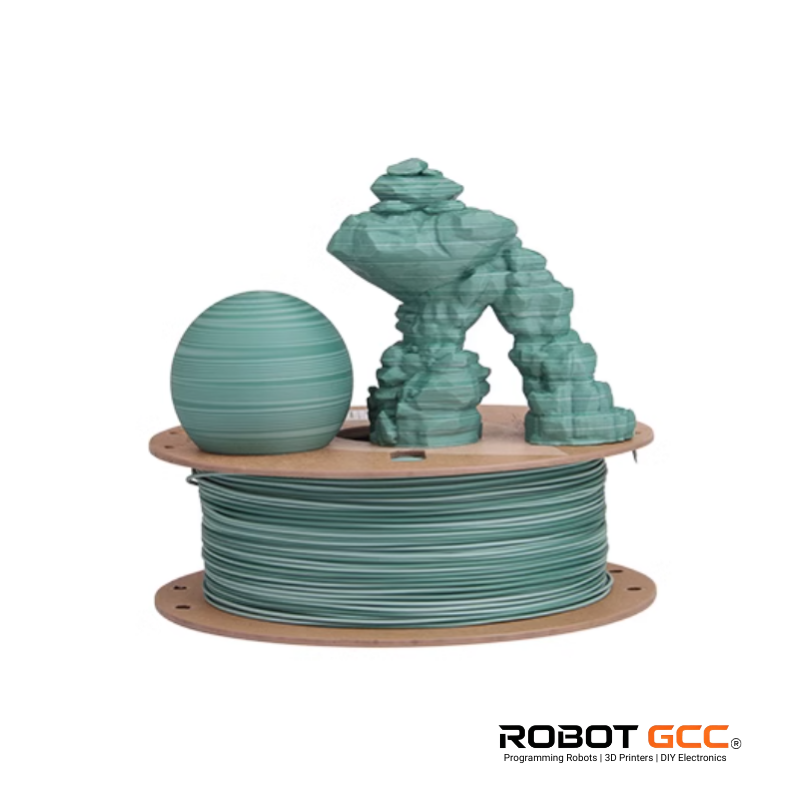 Spool of green 3D printing filament with a small 3D printed object on a white background, featuring the ROBOT GCC logo.