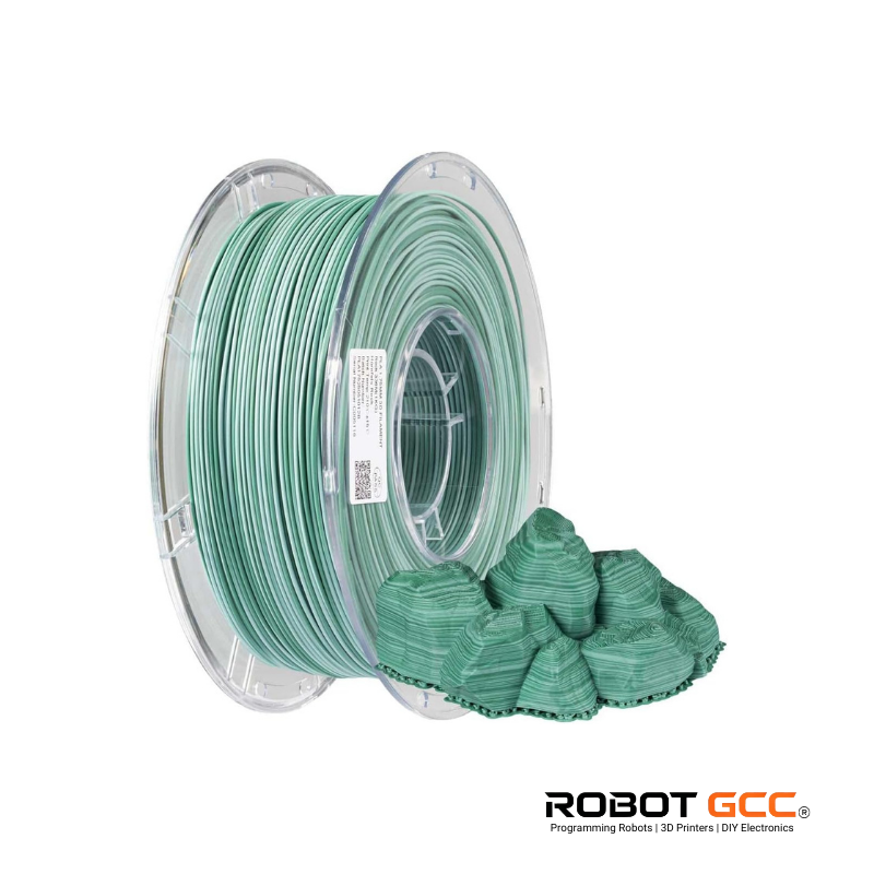 Spool of green filament with a small model piece on a white background, featuring the ROBOT GCC logo.