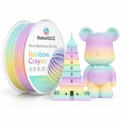Spool of Rainbow Crayon with a colorful tower model and a rainbow-colored bear figure on a white background.