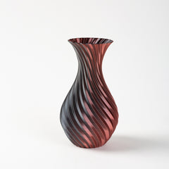 Decorative vase with wavy pattern on a white background