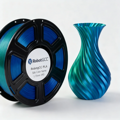 Spool of blue 3D printing filament and a blue vase on a white background