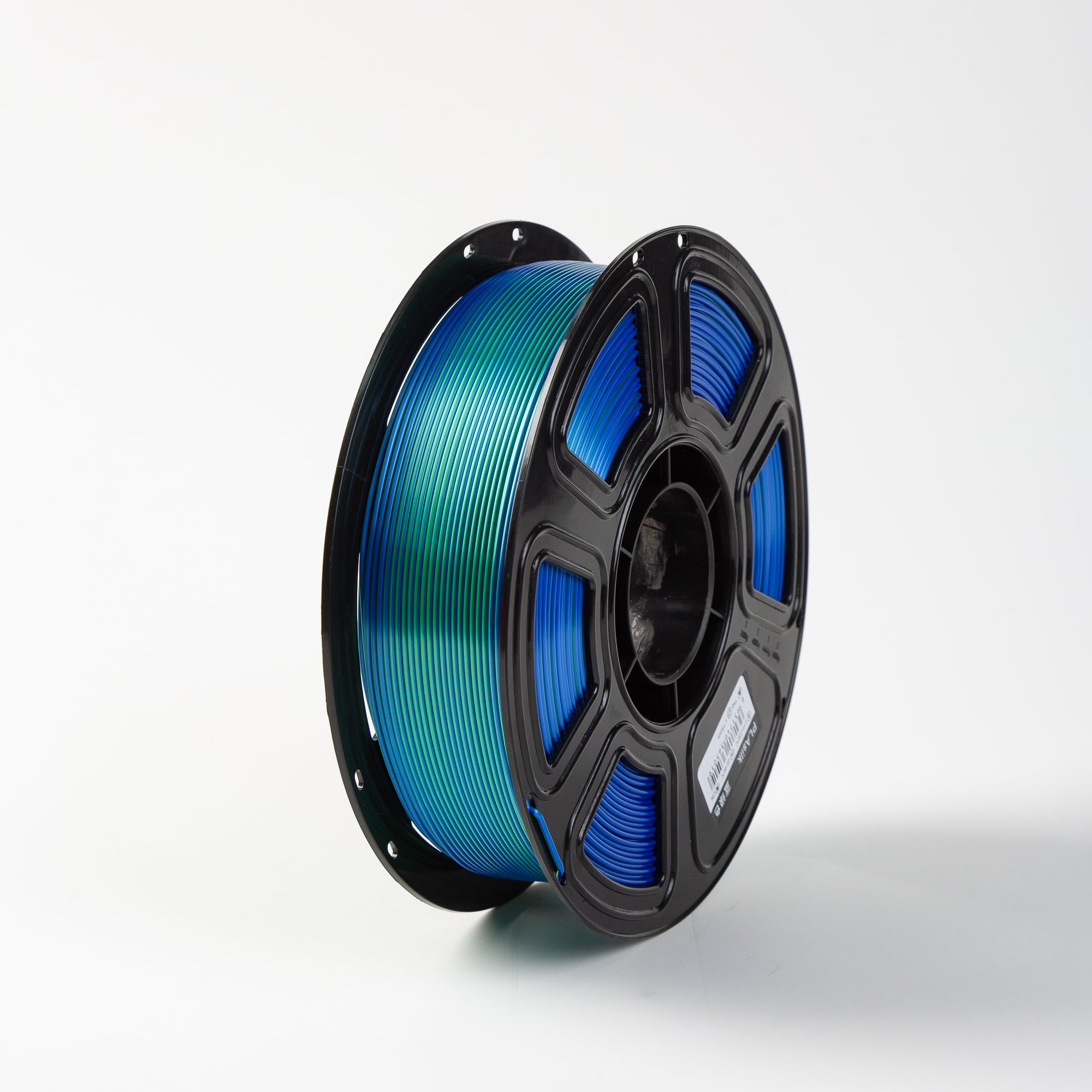 Spool of blue filament on a white background