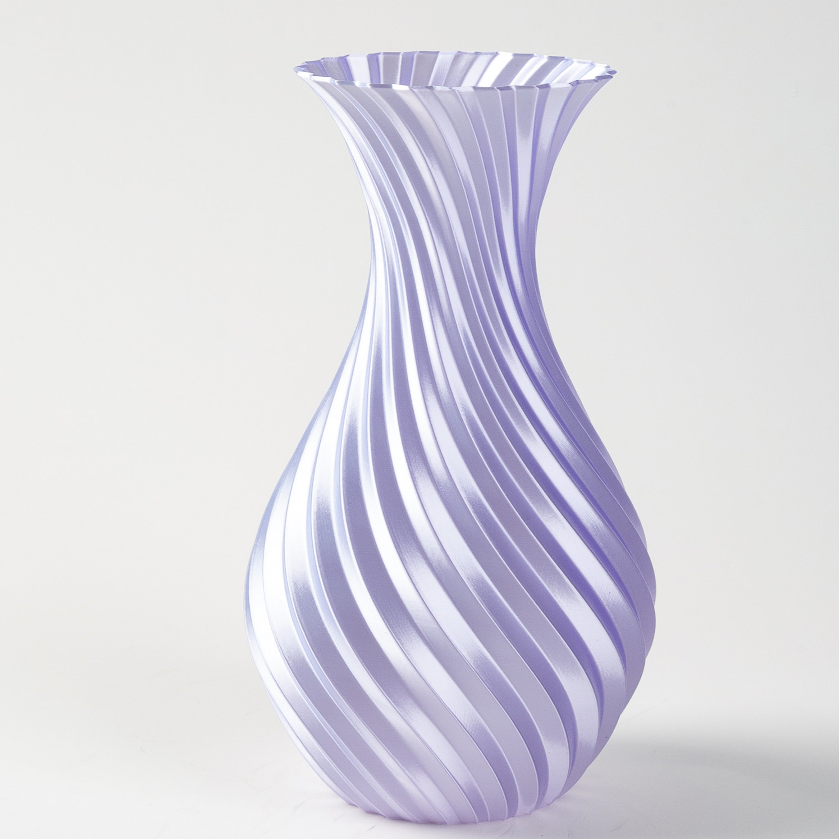 Decorative vase with purple and white swirl pattern on a light gray background