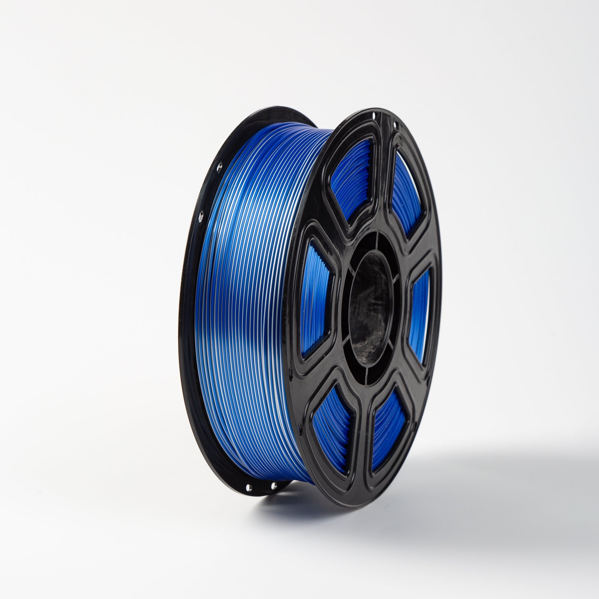 Spool of blue filament on a white background