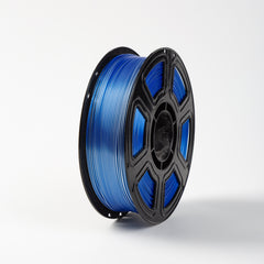 Spool of blue filament on a white background