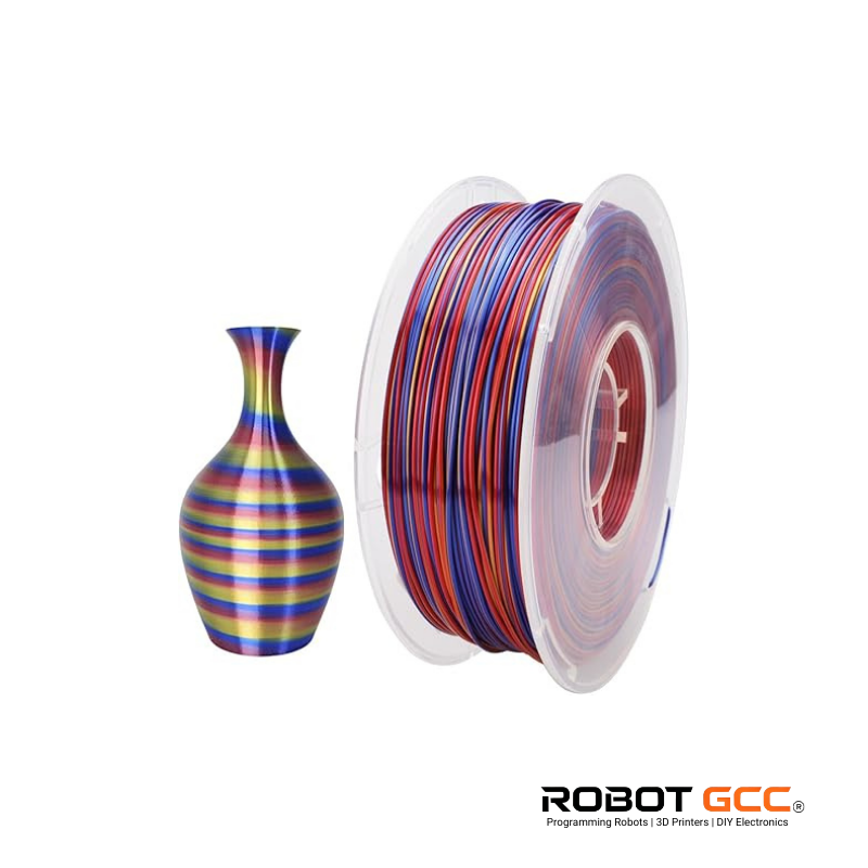 Spool of multicolored filament next to a striped vase on a white background with 'Robot GCC' branding.