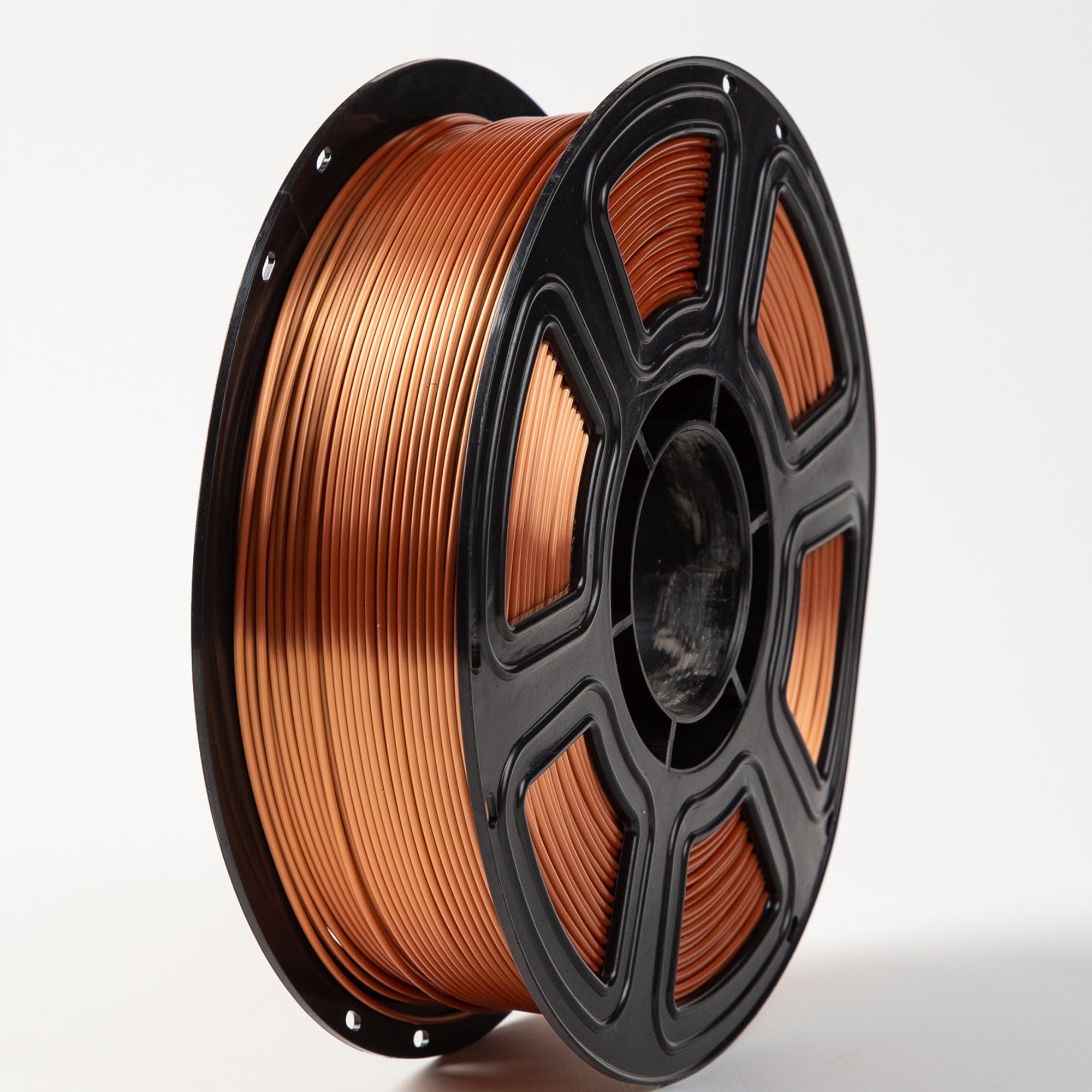Spool of copper wire on a white background