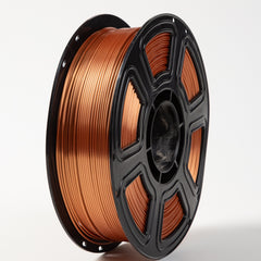 Spool of copper wire on a white background