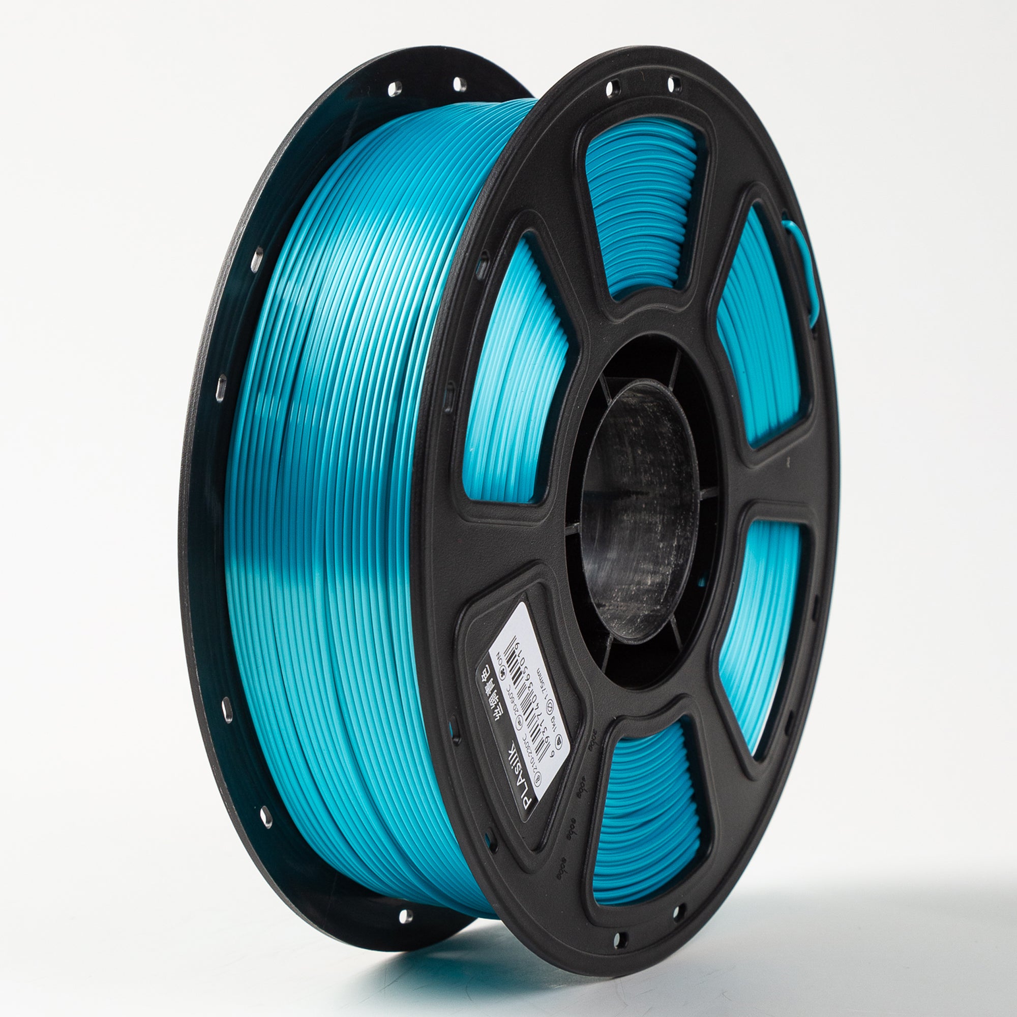 Spool of blue filament on a white background