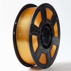 Spool of gold filament on a white background