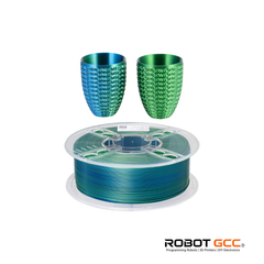 Spool of green filament with two green textured cups on a white background, featuring the Robot GCC logo.