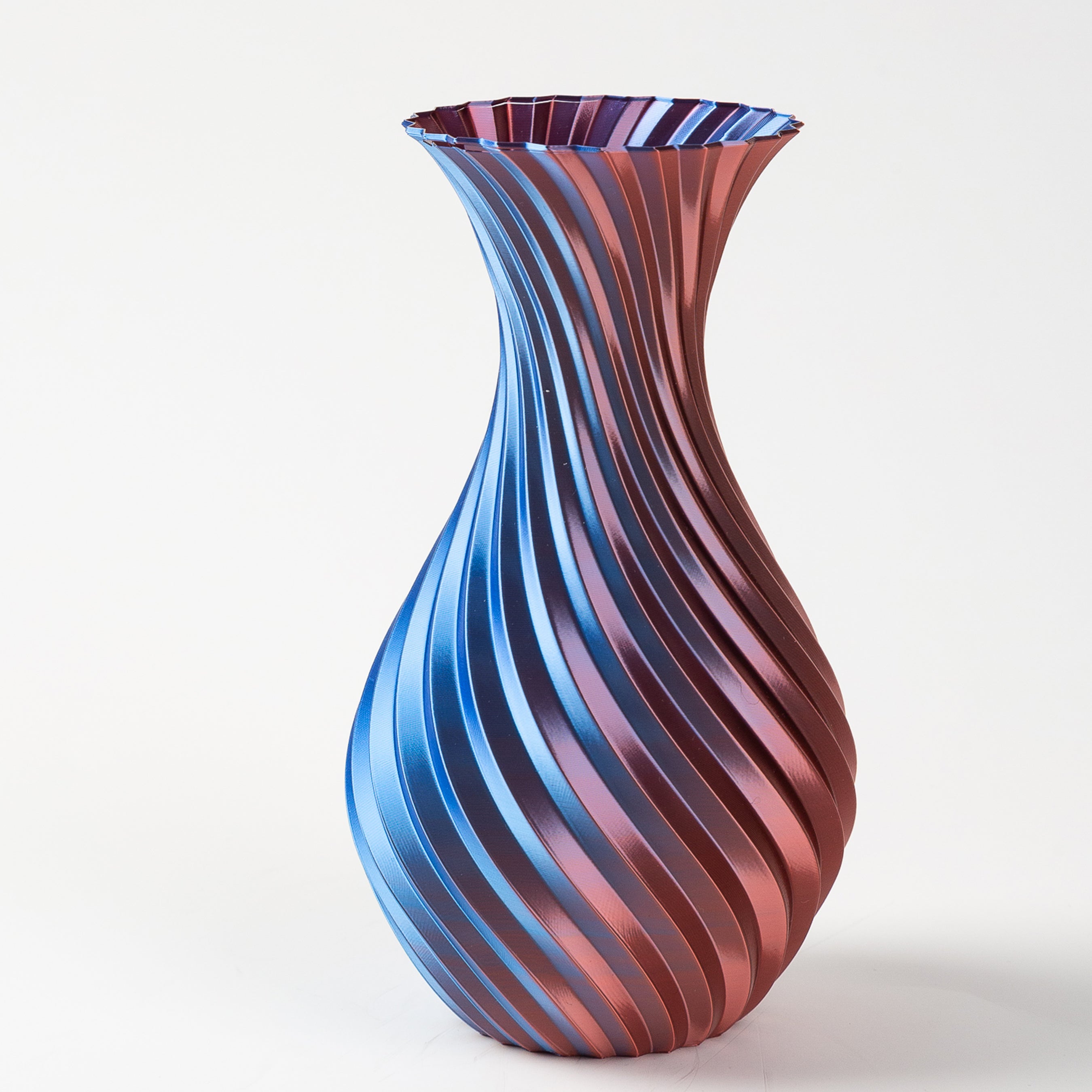 Vase with blue and red striped pattern on a white background