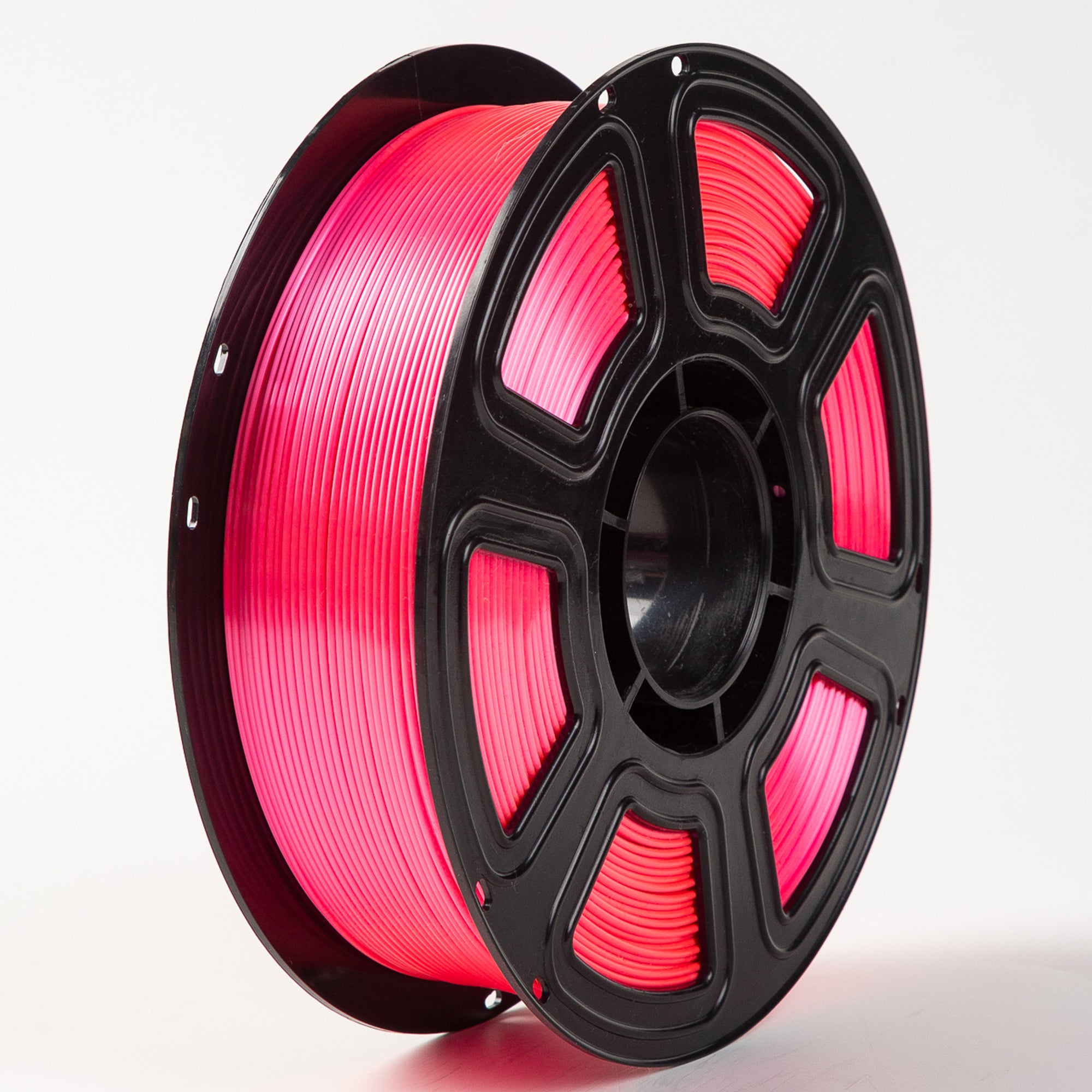 Spool of pink filament on a white background