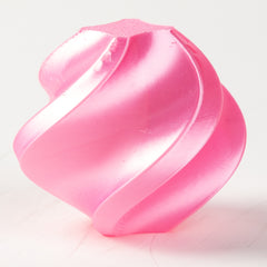 Pink heart-shaped object on a white background