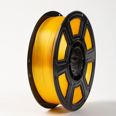 Spool of yellow filament on a white background