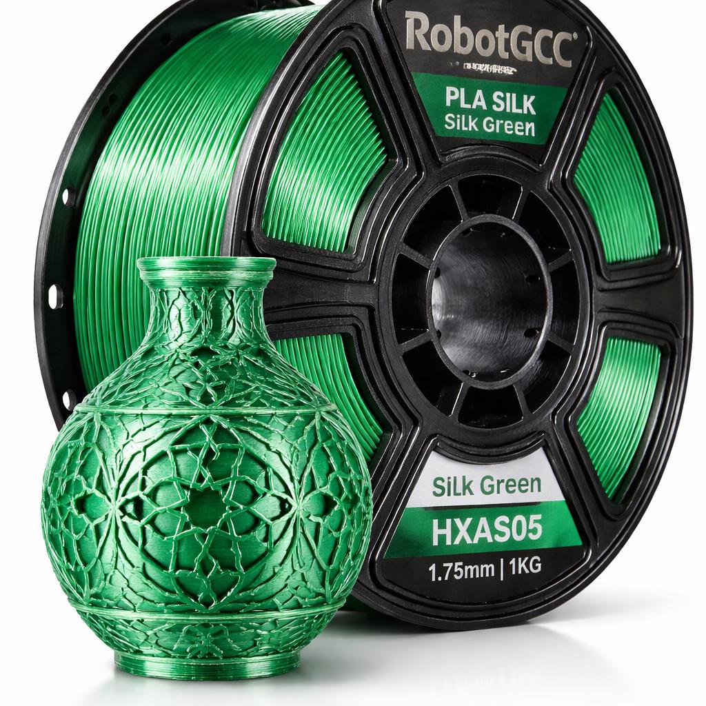 Green 3D printed vase next to a spool of RobotGCC PLA Silk filament on a white background