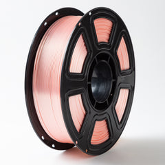 Spool of pink wire on a black reel against a white background