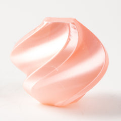 Pink silicone cup on a white background