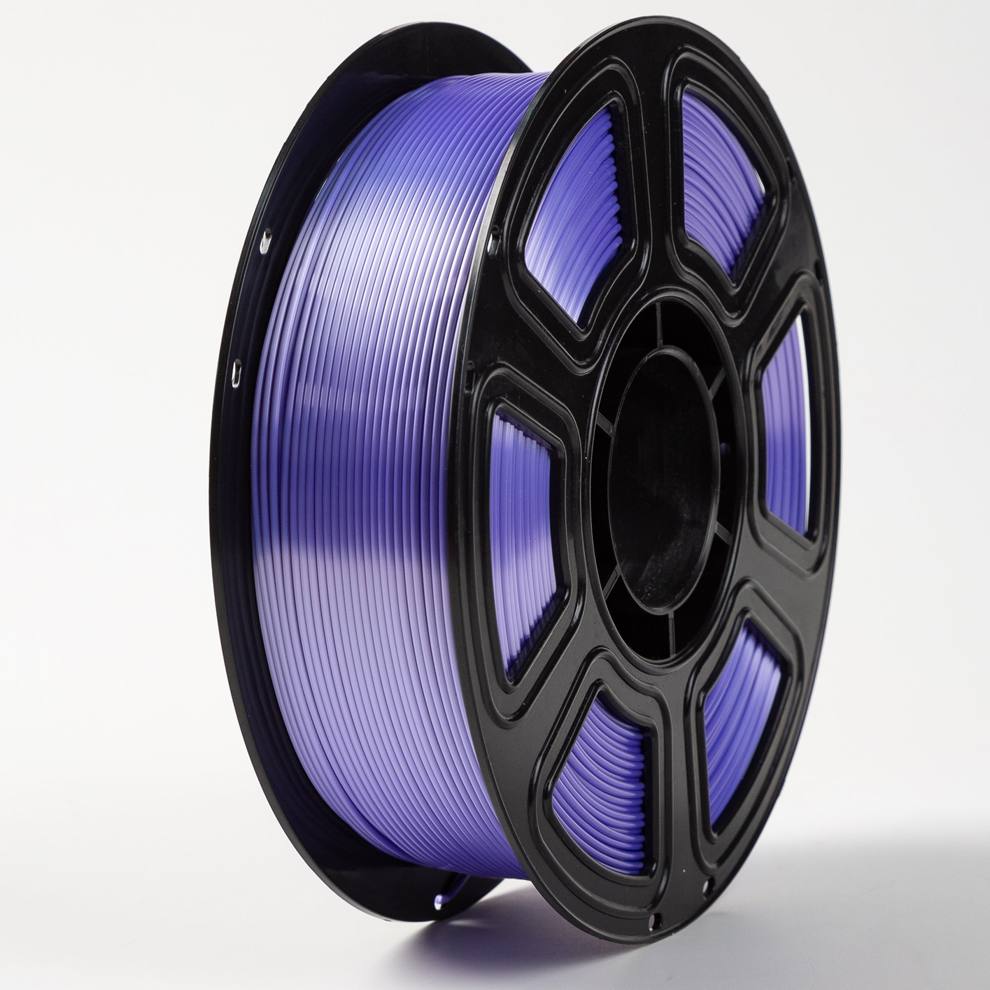 Spool of purple filament on a white background