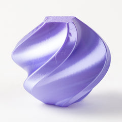 Purple plastic component on a white background