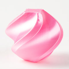 Pink plastic funnel on a white background