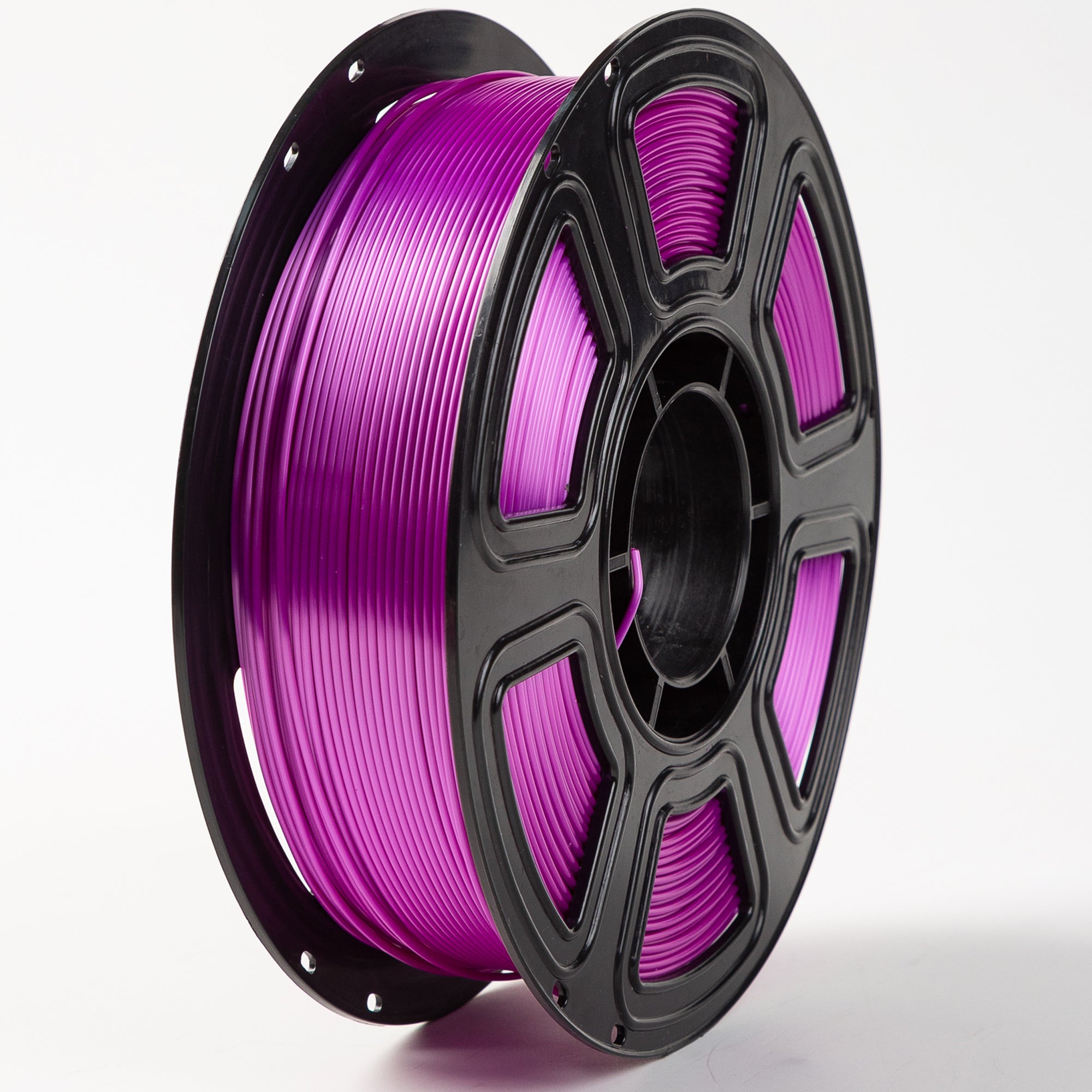 Spool of purple filament on a white background