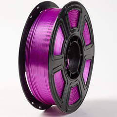 Spool of purple filament on a white background
