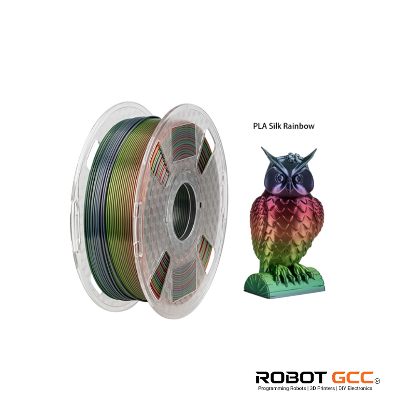 Spool of PLA Silk Rainbow filament and a colorful 3D printed owl model on a white background with ROBOT GCC branding.