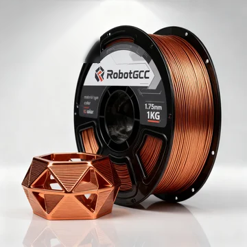 Spool of copper-colored 3D printing filament with a printed geometric object on a white background, featuring the RobotGCC brand.