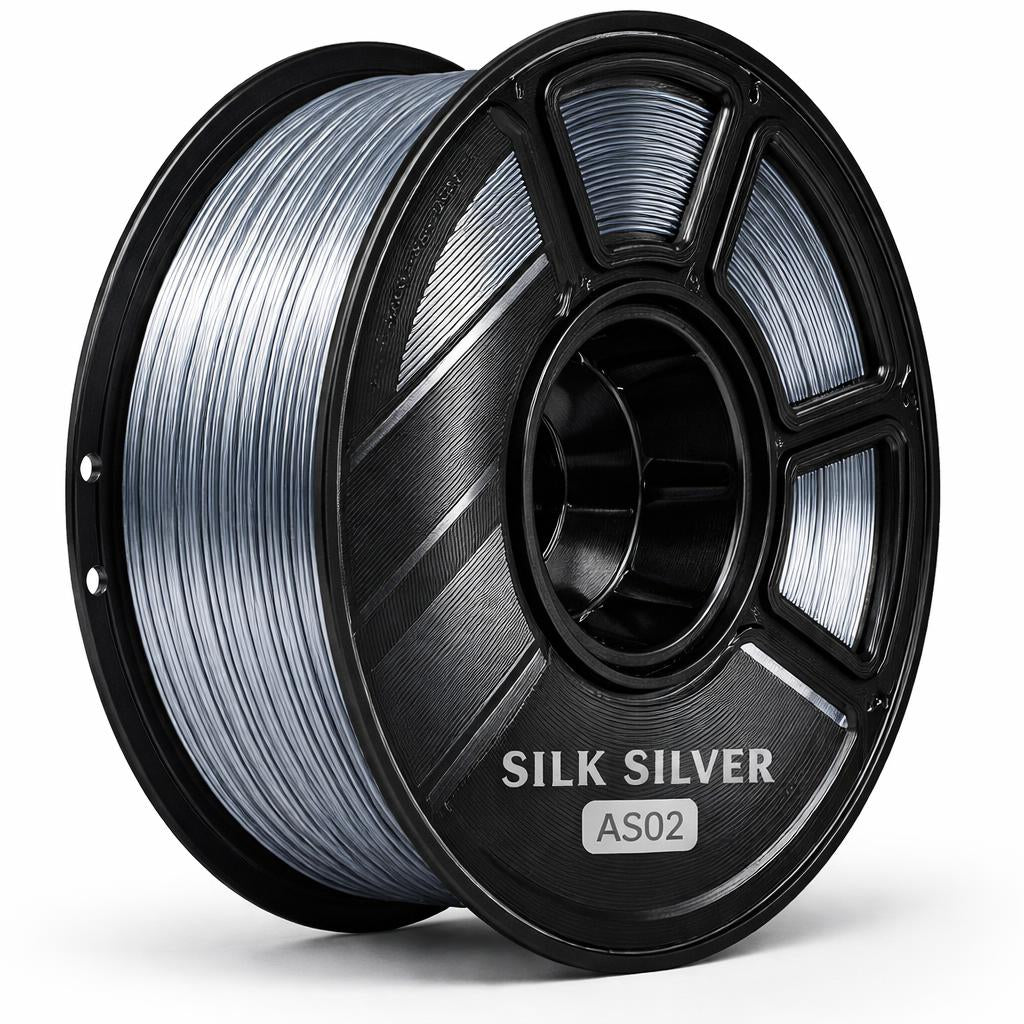 Spool of silk silver filament on a white background