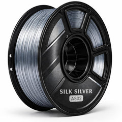 Spool of silk silver filament on a white background