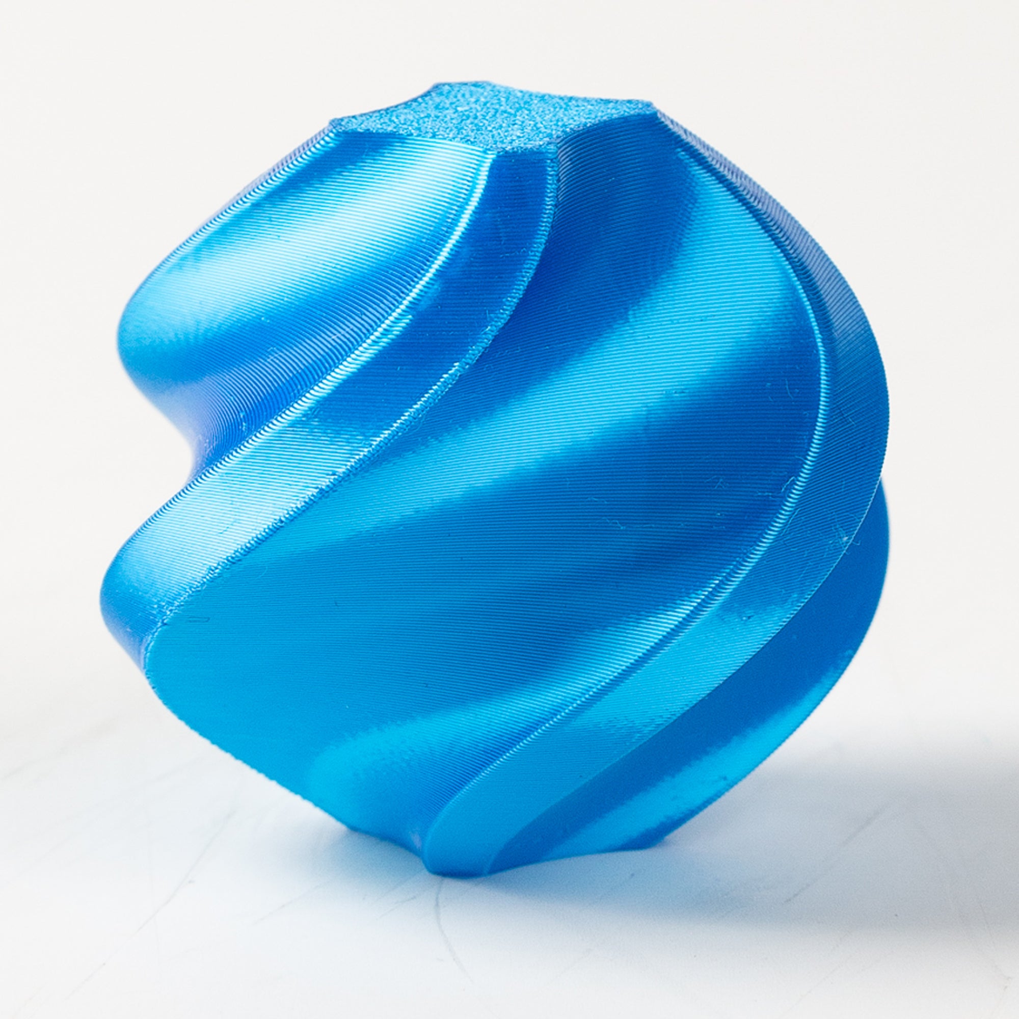 Blue textured object on a white background
