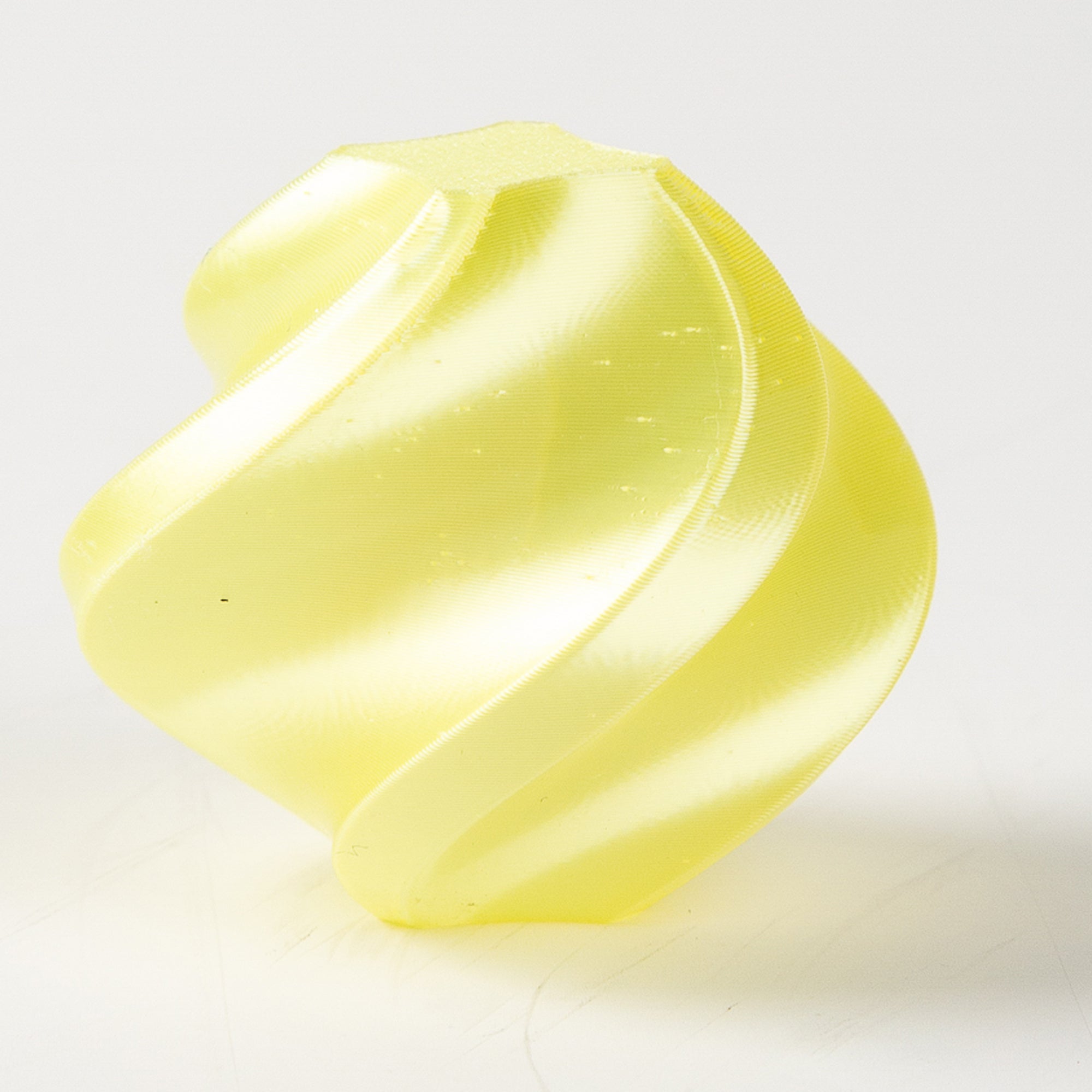 Yellow plastic component on a white background