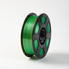 Spool of green filament on a white background