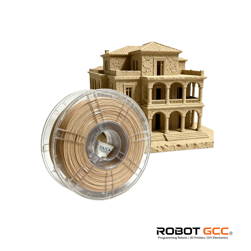 Spool of sand-colored 3D printing filament next to a 3D printed model of a building, with 'Robot GCC' branding.
