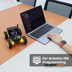 Person programming a robot using Arduino IDE on a laptop with 'Robot GCC' branding.