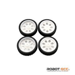 Four wheels with black treads and white centers on a white background, featuring the ROBOT GCC logo.